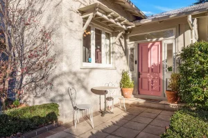 The pink front door opens into the front sunroom.